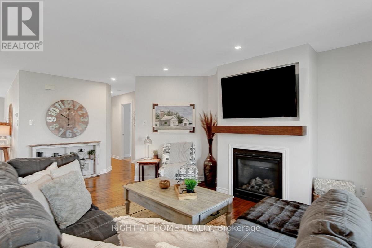 201 Versaille Street, Alfred And Plantagenet, ON - Indoor Photo Showing Living Room With Fireplace