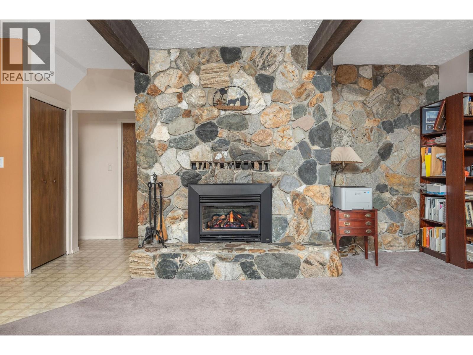 5860 Learmouth Road, Lavington, BC - Indoor Photo Showing Living Room With Fireplace