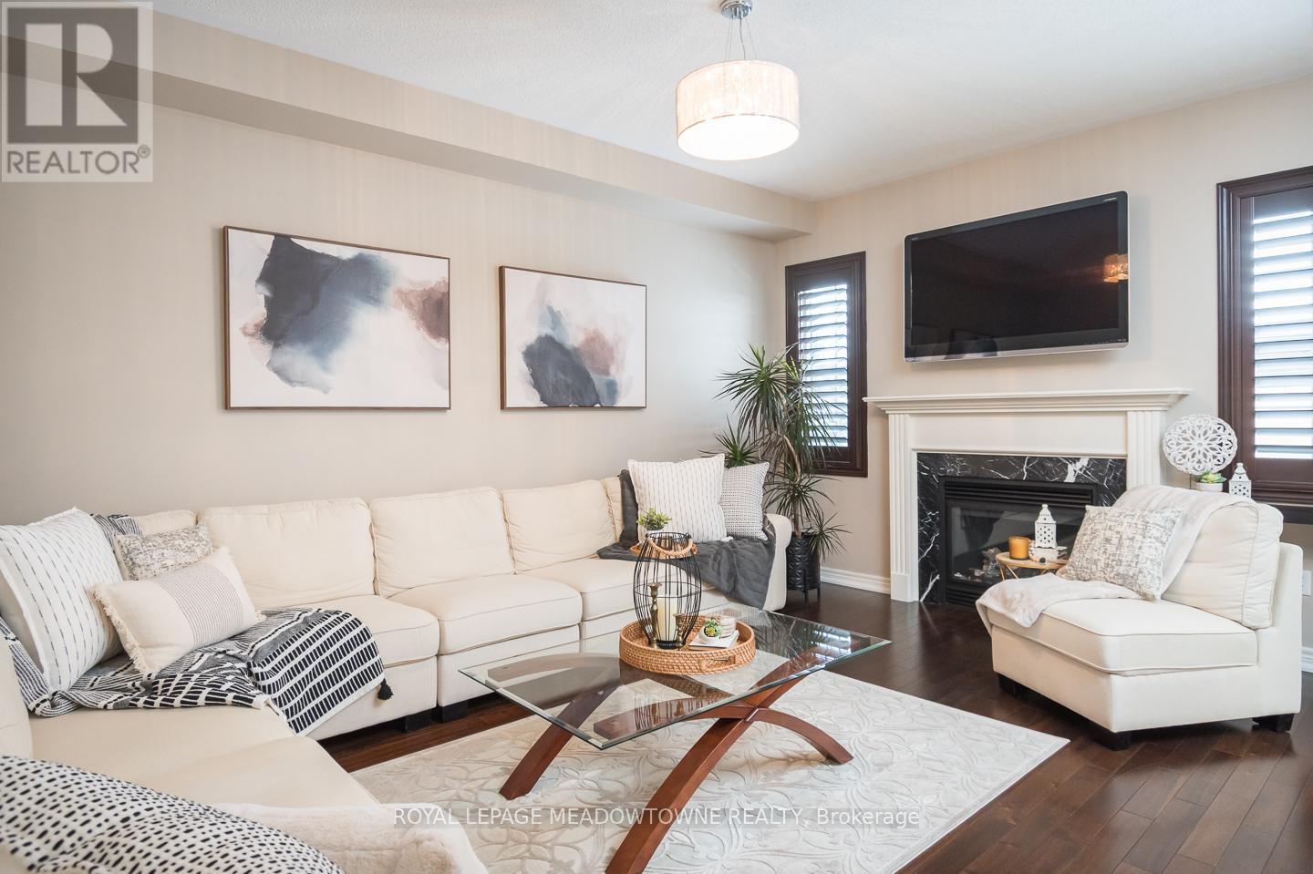 318 Malboeuf Court, Milton, ON - Indoor Photo Showing Living Room With Fireplace