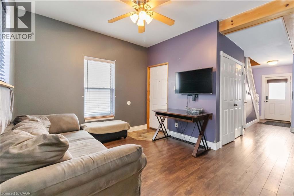 Living room featuring wood type floors and a ceiling fan - 112 Eagle Avenue, Brantford, ON - Indoor