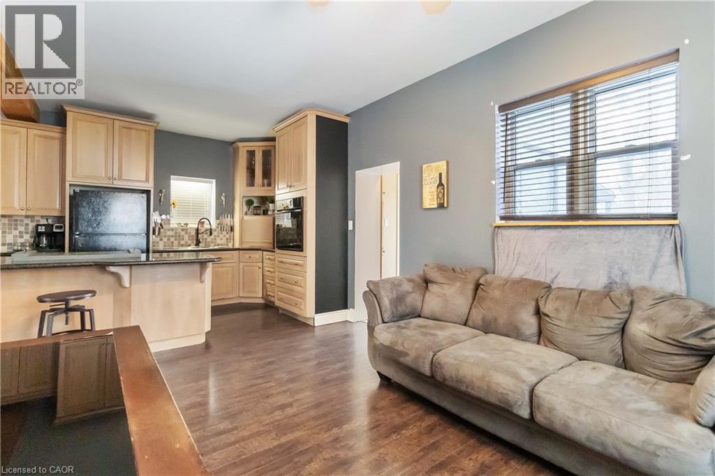 Living room featuring plenty of natural light and dark wood-type flooring - 112 Eagle Avenue, Brantford, ON - Indoor