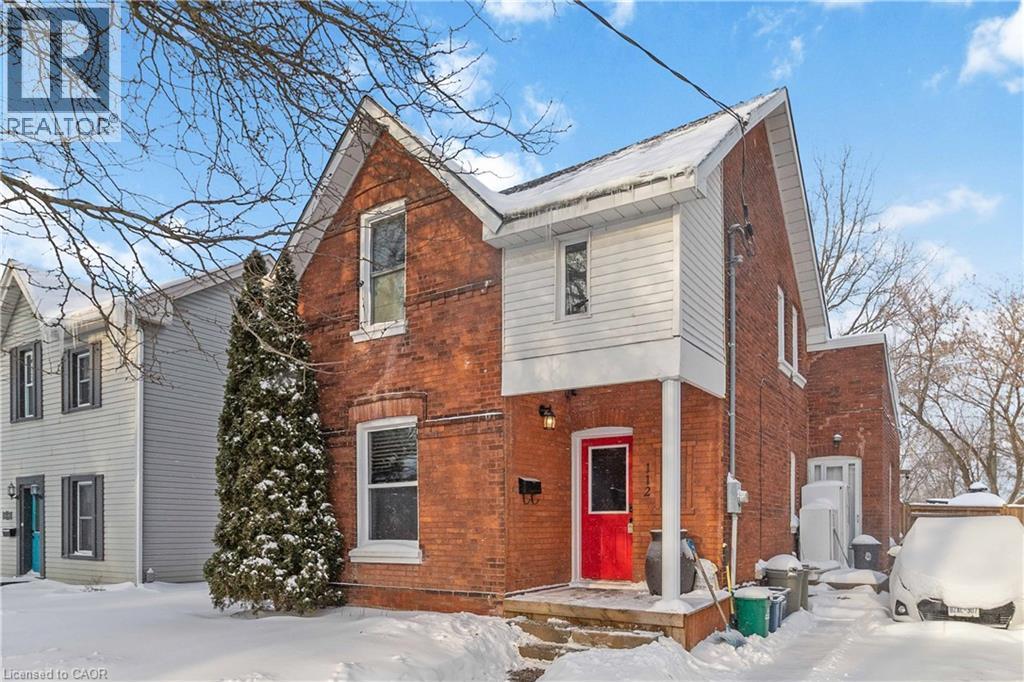 Front of home featuring driveway, walk up to front door, and lawn. - 112 Eagle Avenue, Brantford, ON - Outdoor