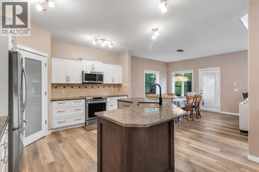 405 Kincora Drive Nw, Calgary, AB - Indoor Photo Showing Kitchen With Stainless Steel Kitchen With Double Sink With Upgraded Kitchen