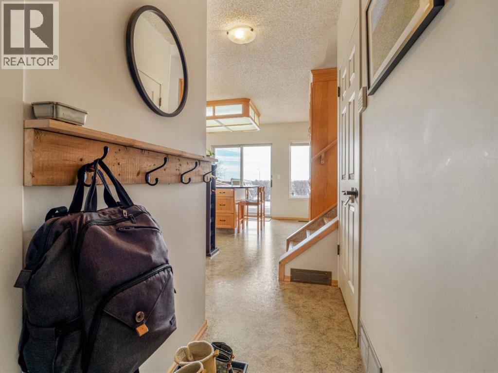 Kitchen hallway has access to garage - 90 Chippewa Crescent W, Lethbridge, AB - Indoor Photo Showing Other Room