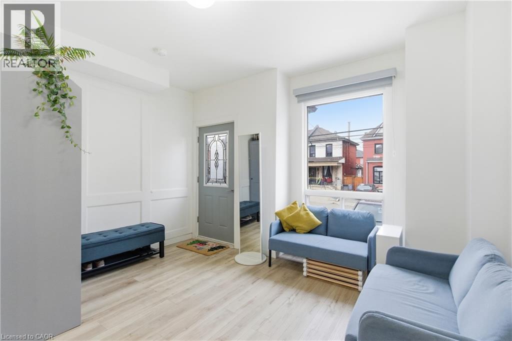 Living area featuring light wood-style floors - 40 Fullerton Avenue, Hamilton, ON - Indoor Photo Showing Living Room