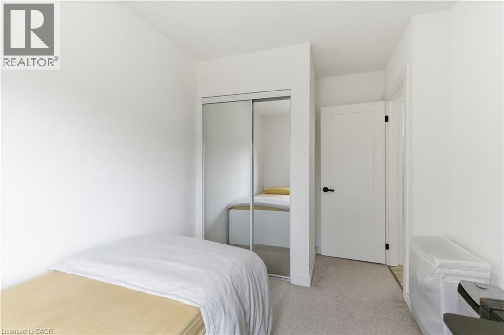 Bedroom with a closet and light colored carpet - 40 Fullerton Avenue, Hamilton, ON - Indoor Photo Showing Bedroom