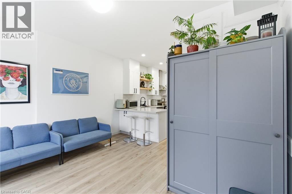 Living room with light wood-style floors and recessed lighting - 40 Fullerton Avenue, Hamilton, ON - Indoor Photo Showing Living Room