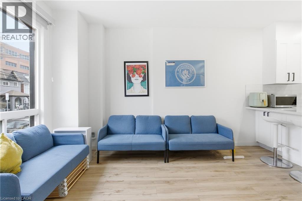 Living area featuring light wood finished floors - 40 Fullerton Avenue, Hamilton, ON - Indoor Photo Showing Living Room