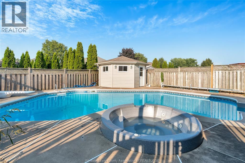 1414 Girard Drive, Lakeshore, ON - Outdoor With In Ground Pool