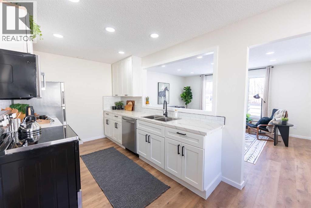 215 Overdown Drive, Red Deer, AB - Indoor Photo Showing Kitchen With Double Sink