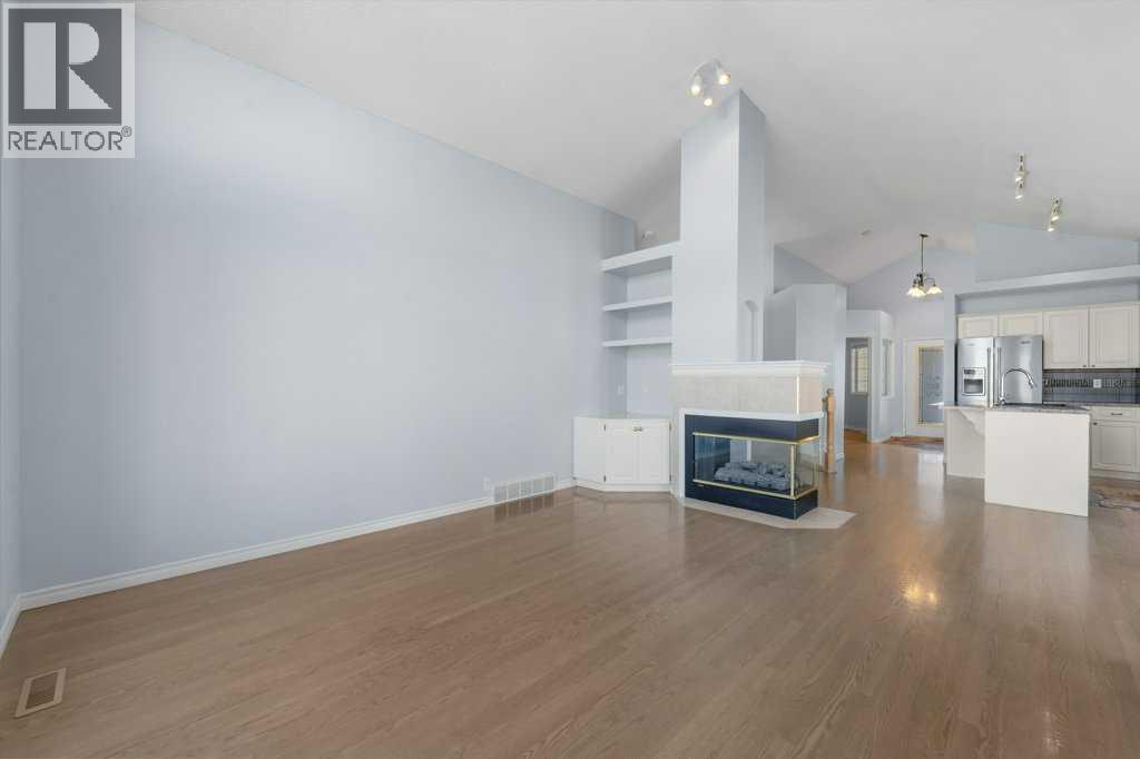 58 Chaparral Close Se, Calgary, AB - Indoor Photo Showing Other Room With Fireplace