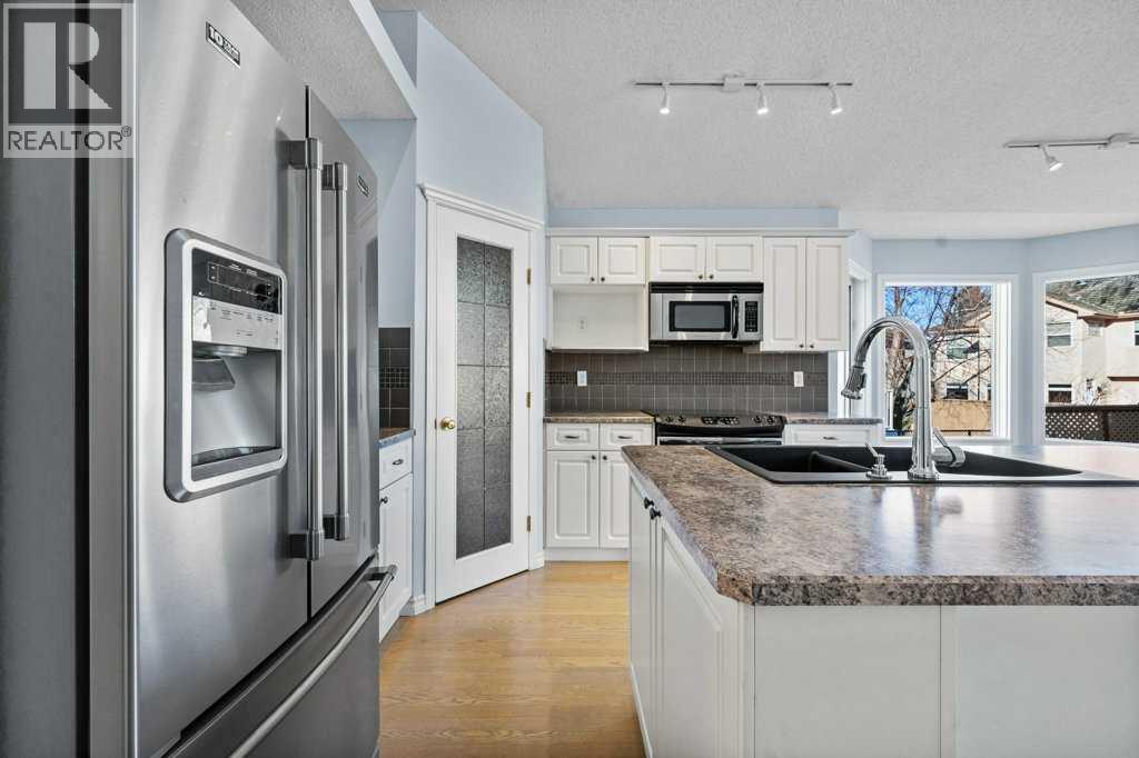 58 Chaparral Close Se, Calgary, AB - Indoor Photo Showing Kitchen With Double Sink With Upgraded Kitchen