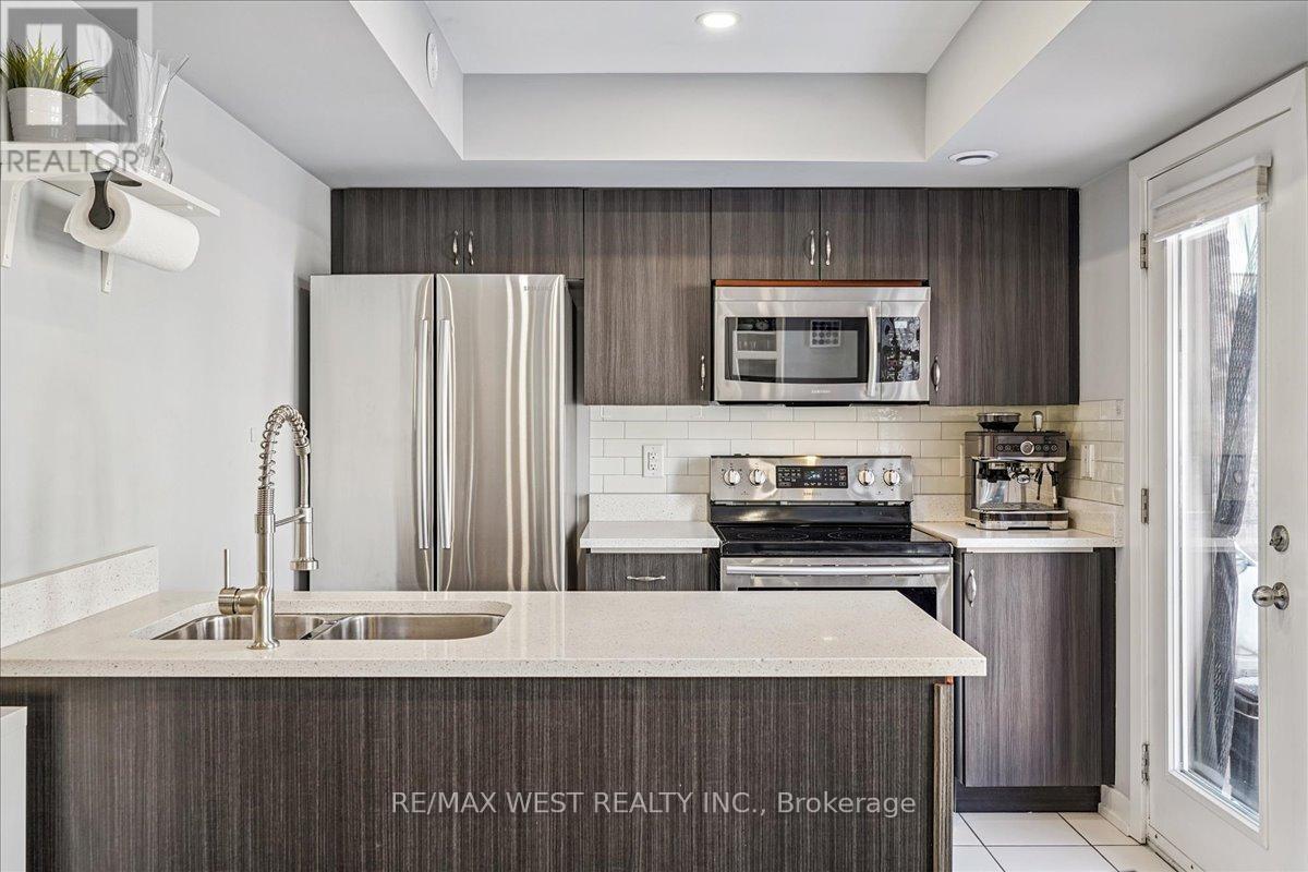 148 - 80 Parrotta Drive, Toronto, ON - Indoor Photo Showing Kitchen With Stainless Steel Kitchen With Double Sink