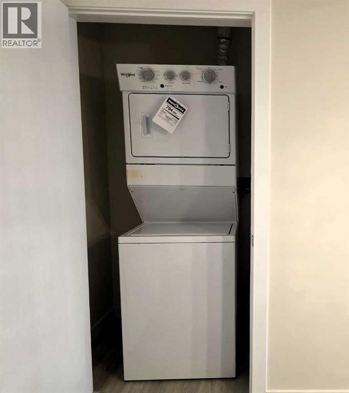 2220, 15 Skyview Point Crescent, Calgary, AB - Indoor Photo Showing Laundry Room
