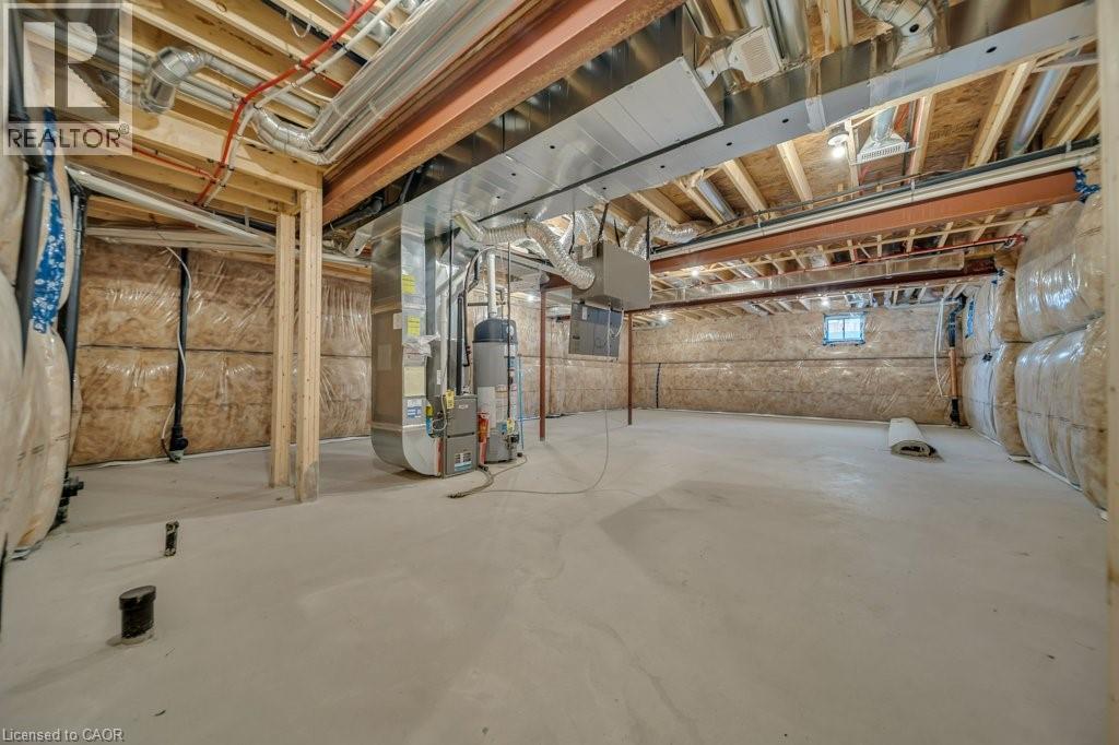 Below grade area with heating unit and water heater - 285 Broadacre Drive, Kitchener, ON - Indoor Photo Showing Basement