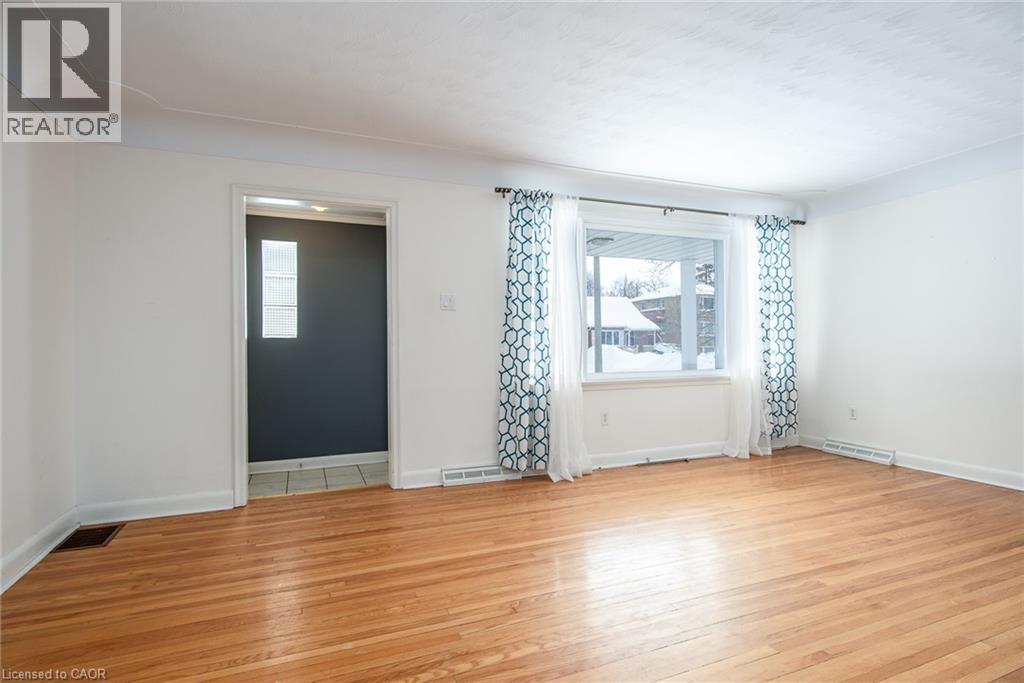 Empty room with light wood-style floors and healthy amount of natural light - 120 Fourth Avenue, Kitchener, ON - Indoor Photo Showing Other Room