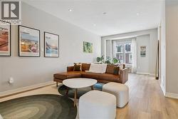 Living area featuring light wood-style floors and recessed lighting -
