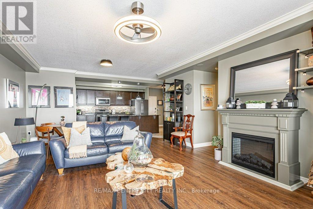 709 - 1030 Coronation Drive, London North (North I), ON - Indoor Photo Showing Living Room With Fireplace