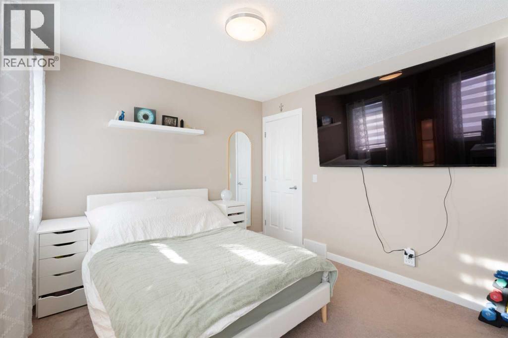 25 Cranwell Place Se, Calgary, AB - Indoor Photo Showing Bedroom