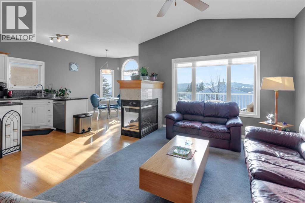 53 Scimitar Heath Nw, Calgary, AB - Indoor Photo Showing Living Room With Fireplace