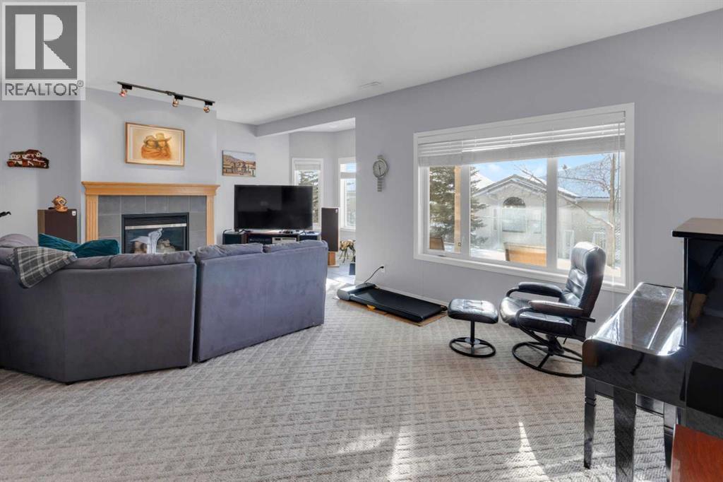 53 Scimitar Heath Nw, Calgary, AB - Indoor Photo Showing Living Room With Fireplace