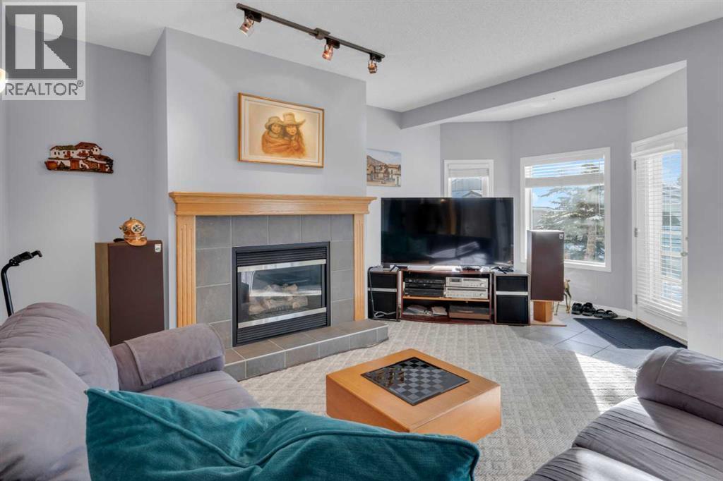 53 Scimitar Heath Nw, Calgary, AB - Indoor Photo Showing Living Room With Fireplace