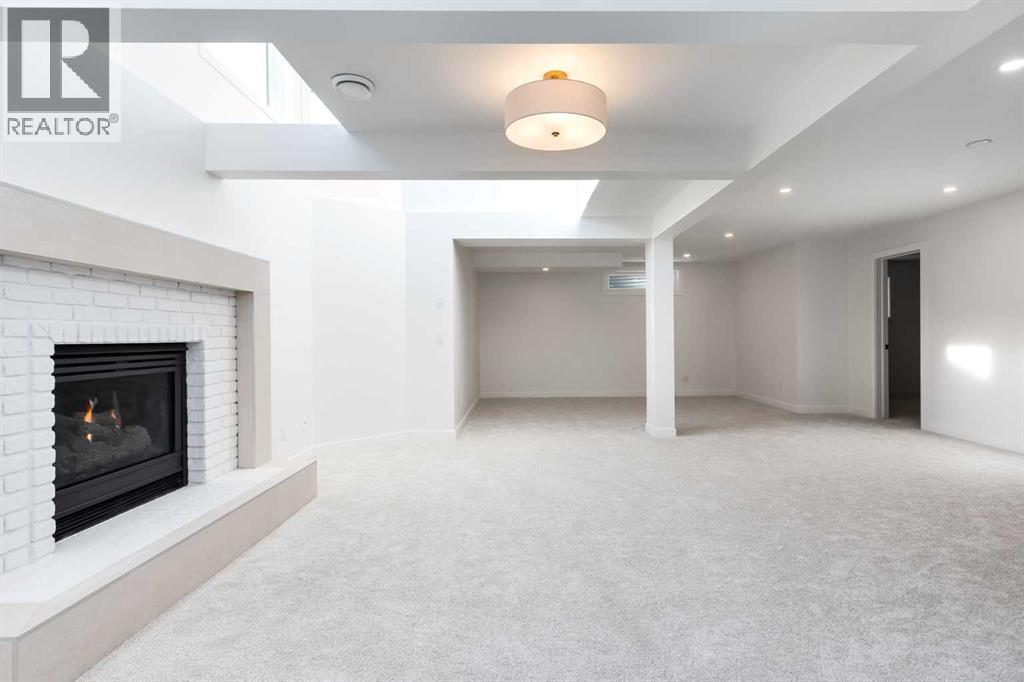 Family/Recreation Room - Basement - 58 Edgevalley Close Nw, Calgary, AB - Indoor With Fireplace