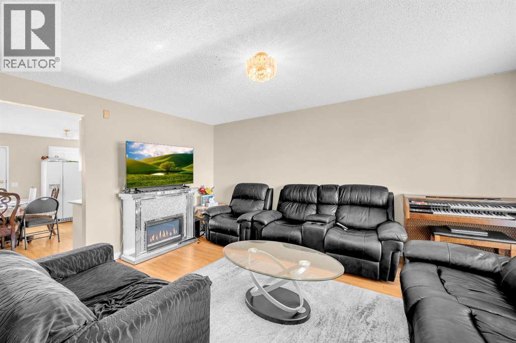 120 Castlebrook Rise Ne, Calgary, AB - Indoor Photo Showing Living Room With Fireplace