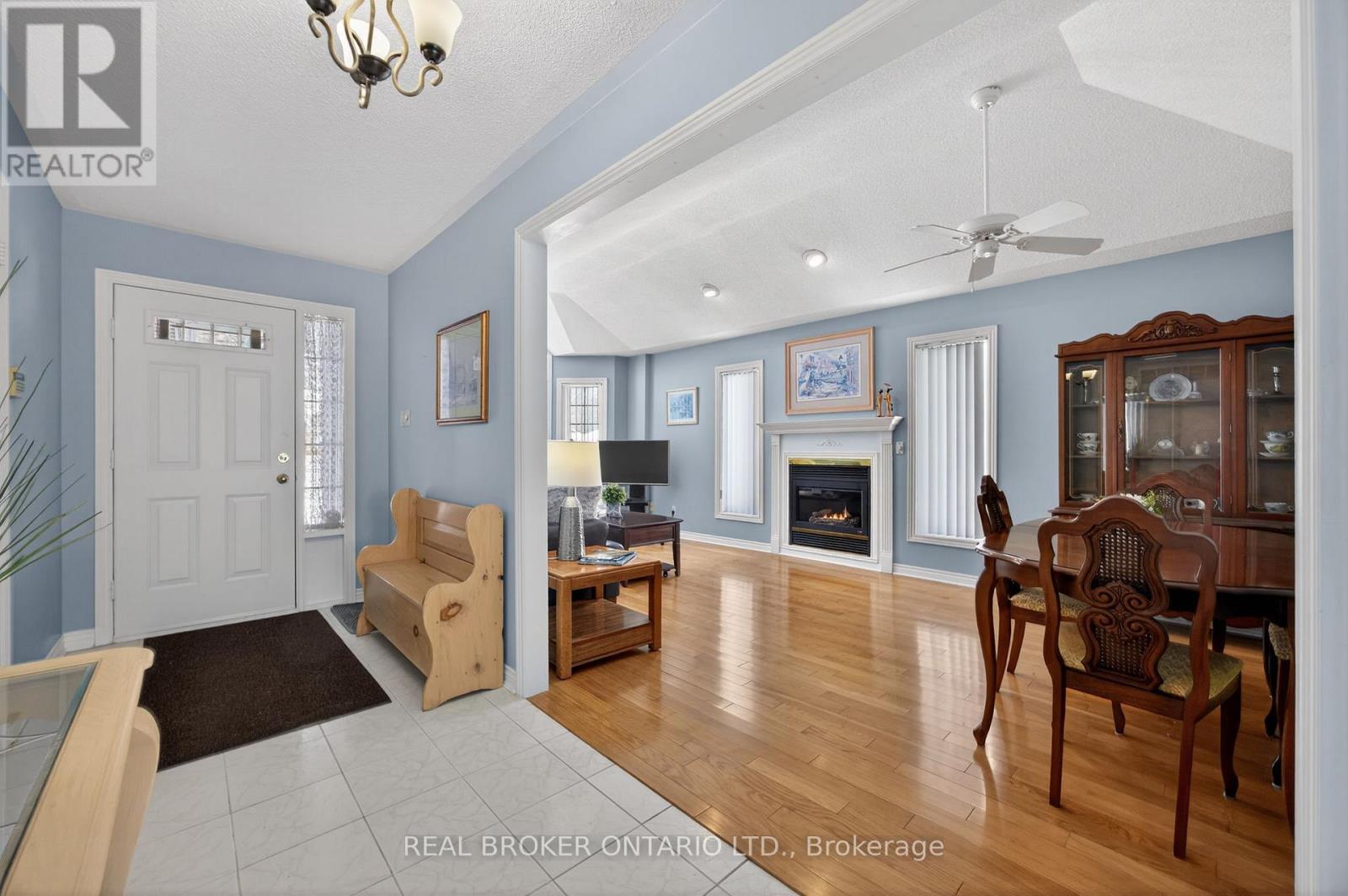 Entry and family room dining room - 9 Riverdale Drive, Wasaga Beach, ON - Indoor With Fireplace