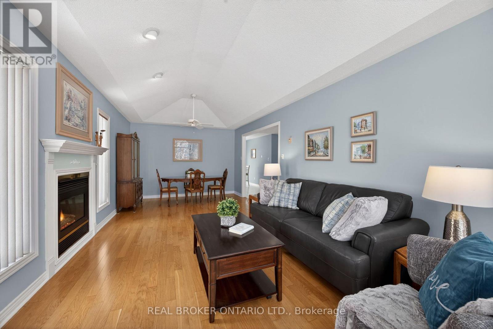 Large room hardwood floors - 9 Riverdale Drive, Wasaga Beach, ON - Indoor Photo Showing Living Room With Fireplace