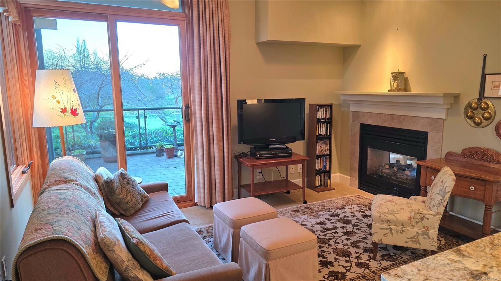 108-5329 Cordova Bay Rd, Saanich, BC - Indoor Photo Showing Living Room With Fireplace