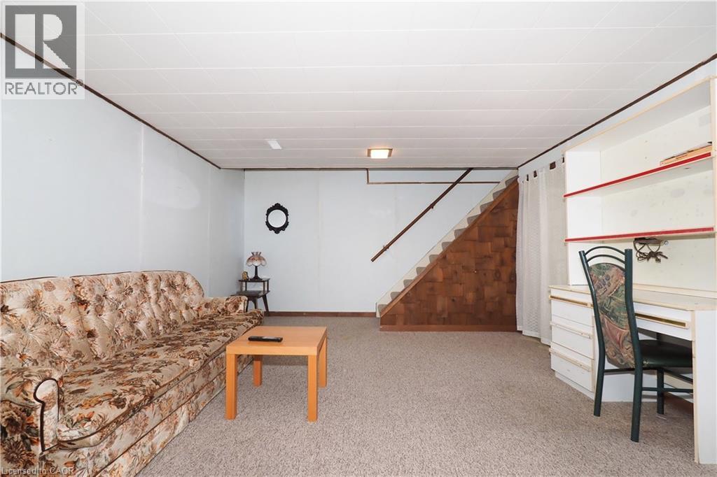 Living area with light colored carpet and stairway - 10 Balfour Crescent, Kitchener, ON - Indoor Photo Showing Other Room