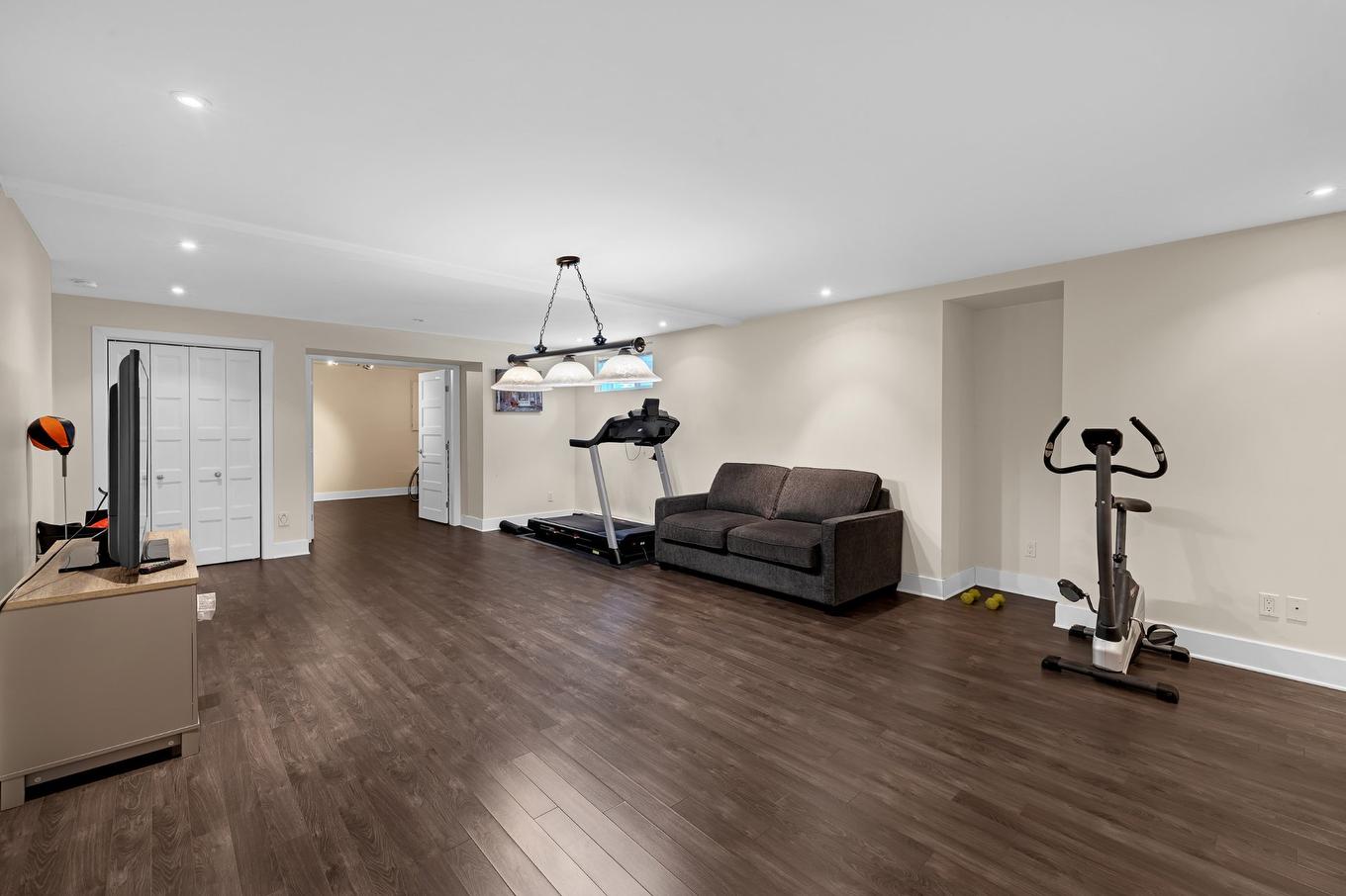 Family room - 3925 Rue Oslo, Brossard, QC - Indoor Photo Showing Gym Room