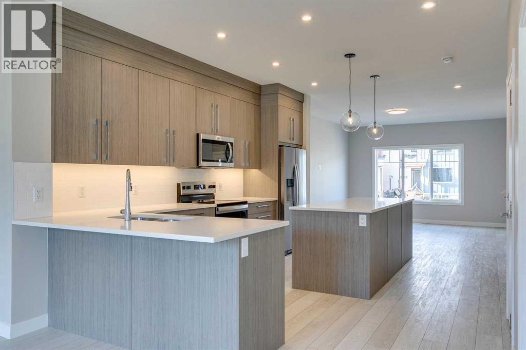 642 Rangeview Street Se, Calgary, AB - Indoor Photo Showing Kitchen With Stainless Steel Kitchen With Double Sink With Upgraded Kitchen