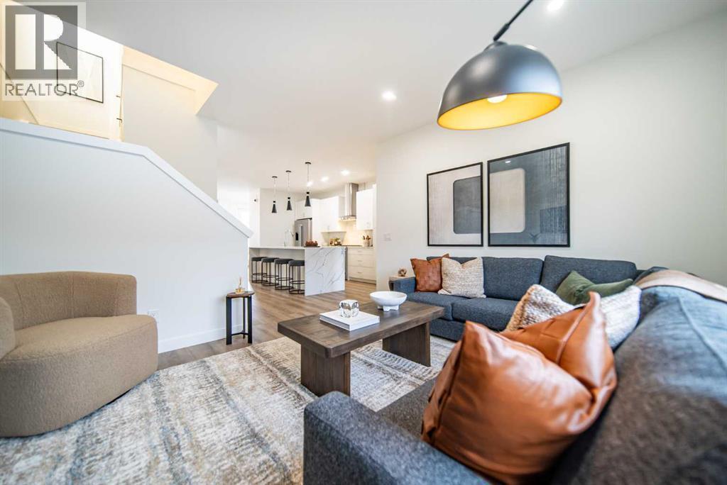 1149 Sailfin Heath, Rural Rocky View County, AB - Indoor Photo Showing Living Room With Fireplace