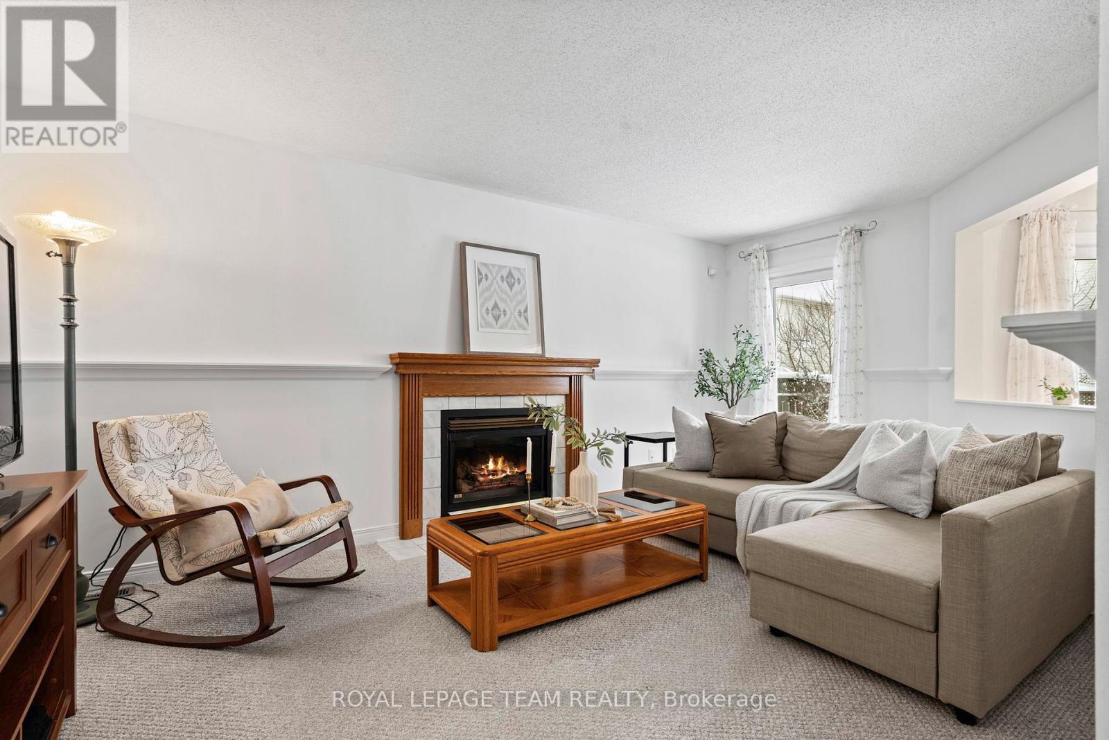 27 Avonmore Crescent, Ottawa, ON - Indoor Photo Showing Living Room With Fireplace