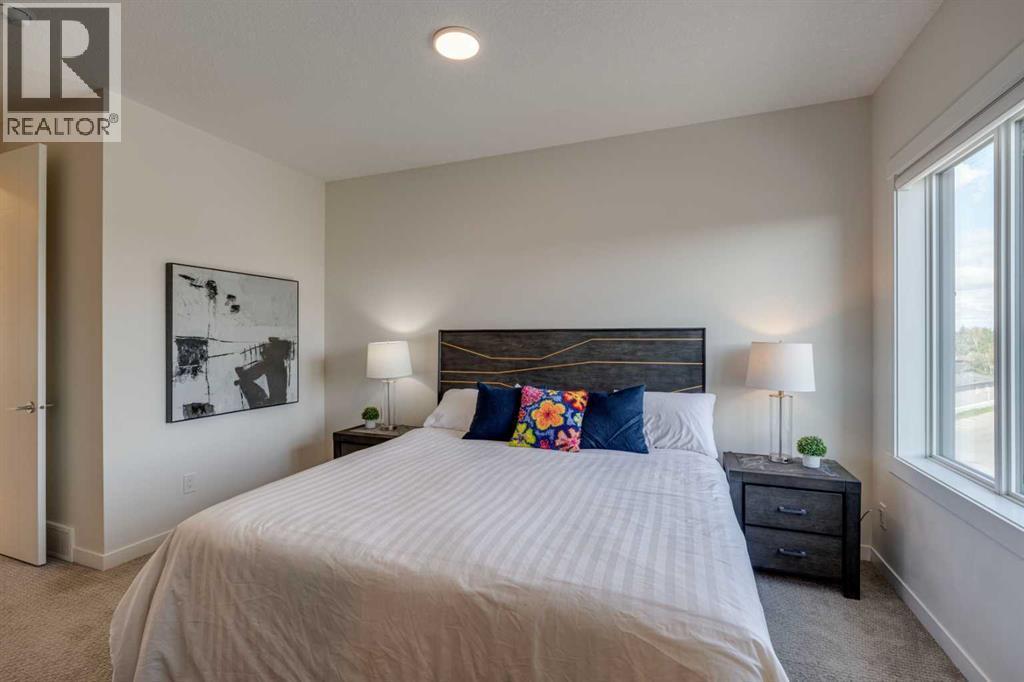 Upper level primary bedroom - 614 Greenbriar Common Nw, Calgary, AB - Indoor Photo Showing Bedroom