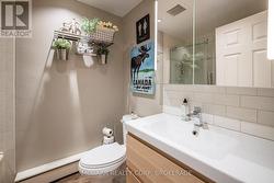 Four piece with glass doors on tub/shower -