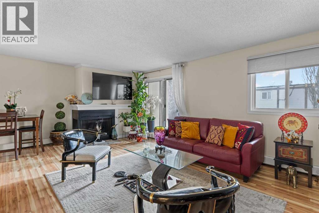 301, 305 25 Avenue Sw, Calgary, AB - Indoor Photo Showing Living Room With Fireplace