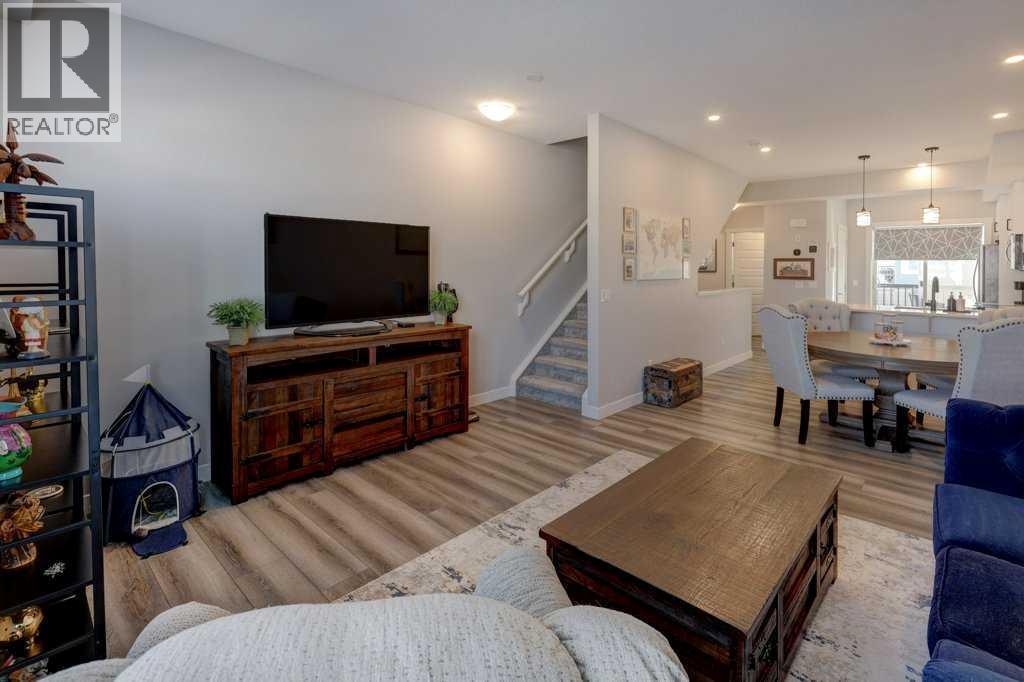 703, 115 Sagewood Drive Sw, Airdrie, AB - Indoor Photo Showing Living Room