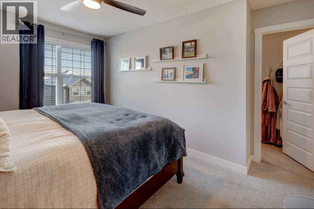 703, 115 Sagewood Drive Sw, Airdrie, AB - Indoor Photo Showing Bedroom