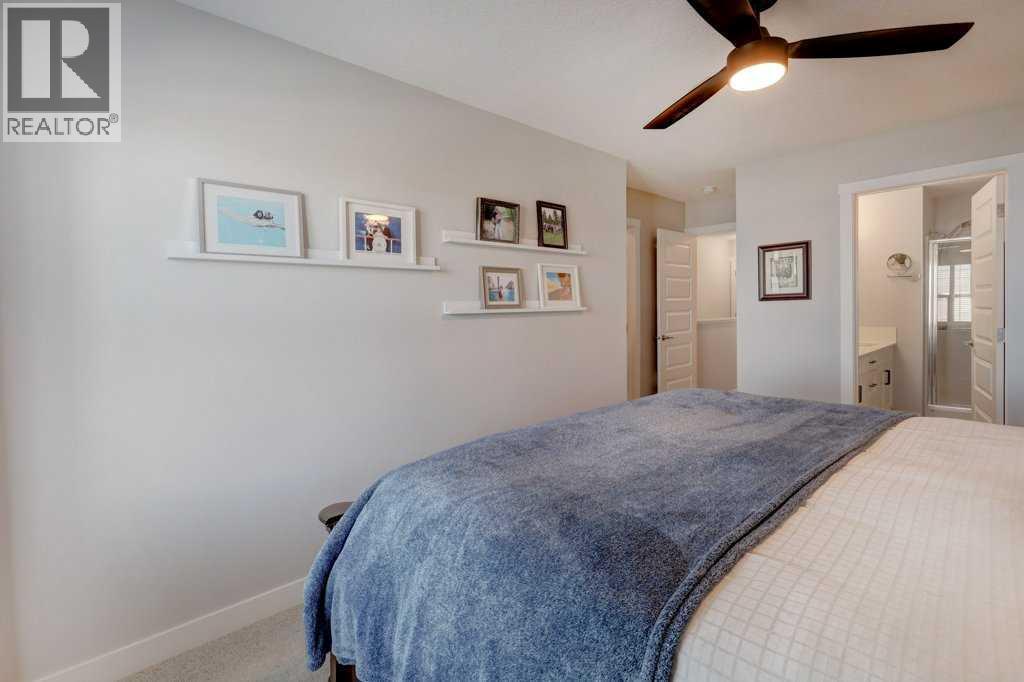 703, 115 Sagewood Drive Sw, Airdrie, AB - Indoor Photo Showing Bedroom