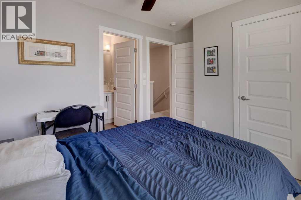 703, 115 Sagewood Drive Sw, Airdrie, AB - Indoor Photo Showing Bedroom