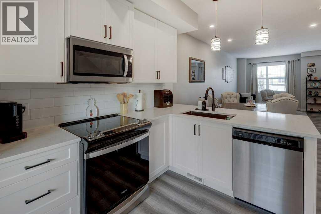 703, 115 Sagewood Drive Sw, Airdrie, AB - Indoor Photo Showing Kitchen