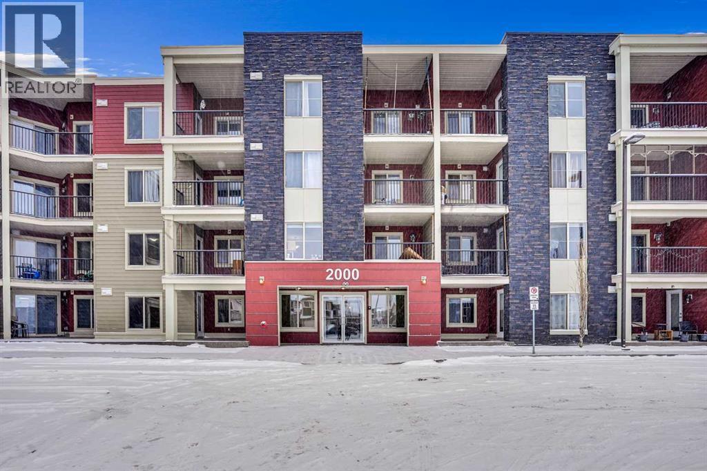 BUILDING MAIN ENTRANCE - 411, 15 Saddlestone Way Ne, Calgary, AB - Outdoor With Balcony With Facade