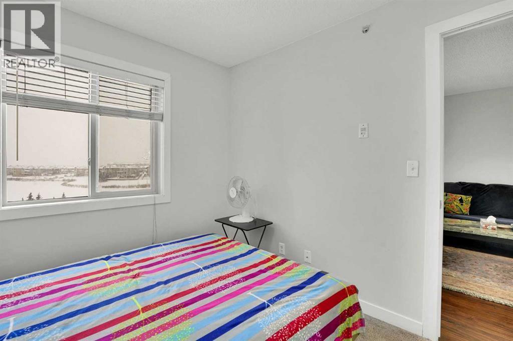 411, 15 Saddlestone Way Ne, Calgary, AB - Indoor Photo Showing Bedroom