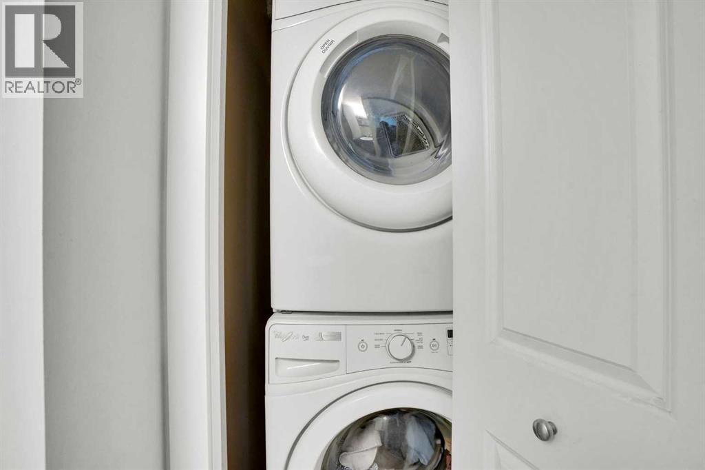 IN UNIT LAUNDRY - 411, 15 Saddlestone Way Ne, Calgary, AB - Indoor Photo Showing Laundry Room