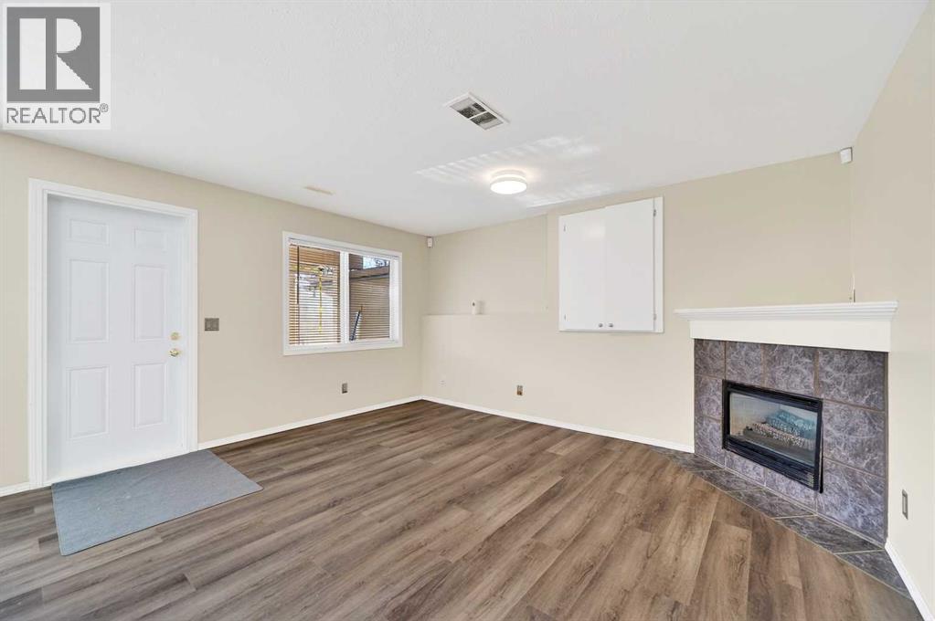 30 Tuscarora Way Nw, Calgary, AB - Indoor With Fireplace