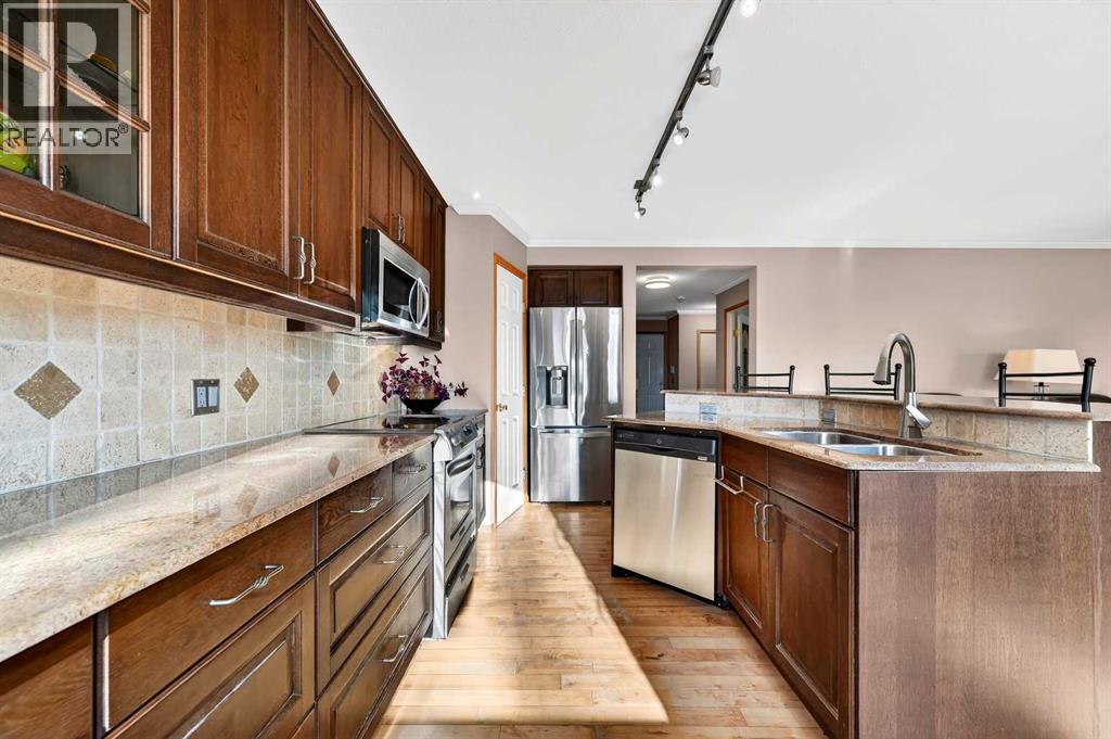 30 Tuscarora Way Nw, Calgary, AB - Indoor Photo Showing Kitchen With Stainless Steel Kitchen With Double Sink