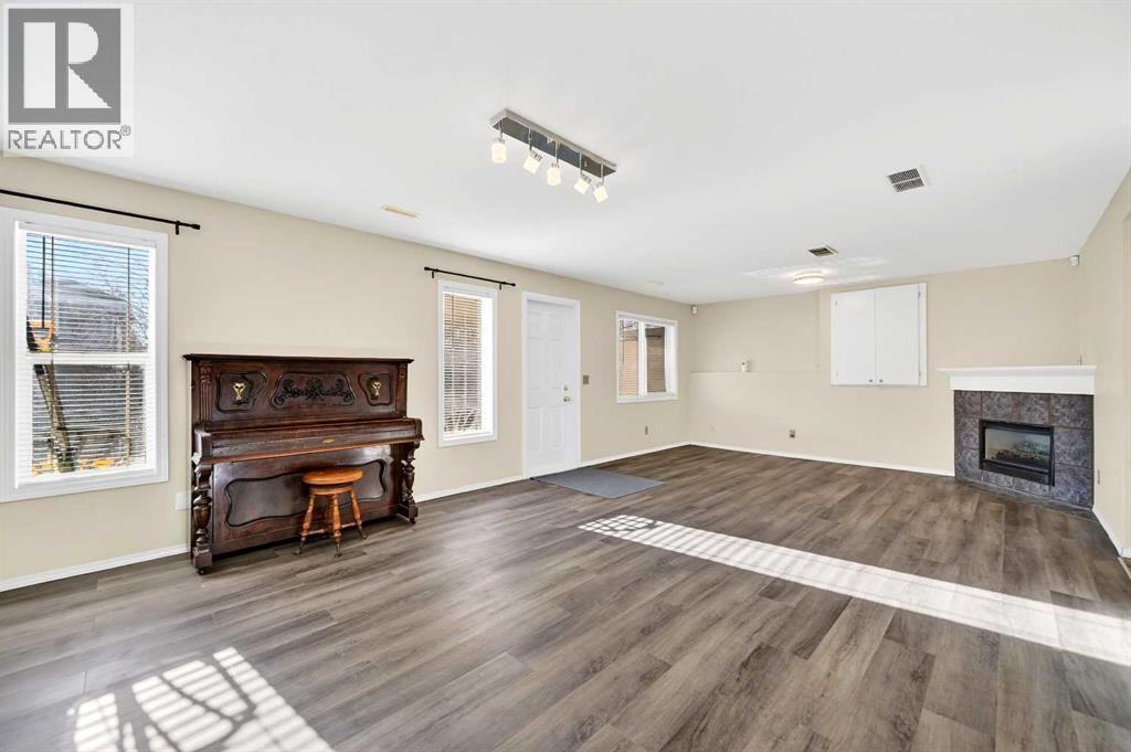 30 Tuscarora Way Nw, Calgary, AB - Indoor With Fireplace